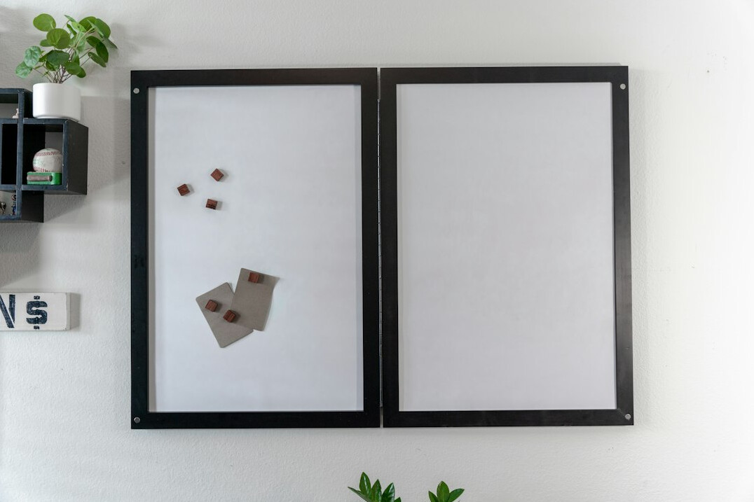 Whiteboard covered with strategic diagrams and notes